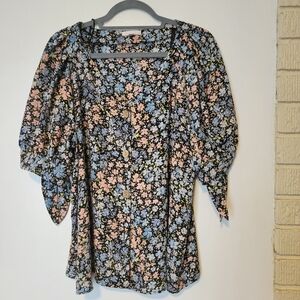 Lauren Conrad button front beautiful floral blouse with a scoop neckline.